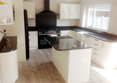 Contemporary kitchen finished with Star Galaxy granite worktops with full-height hob splash back